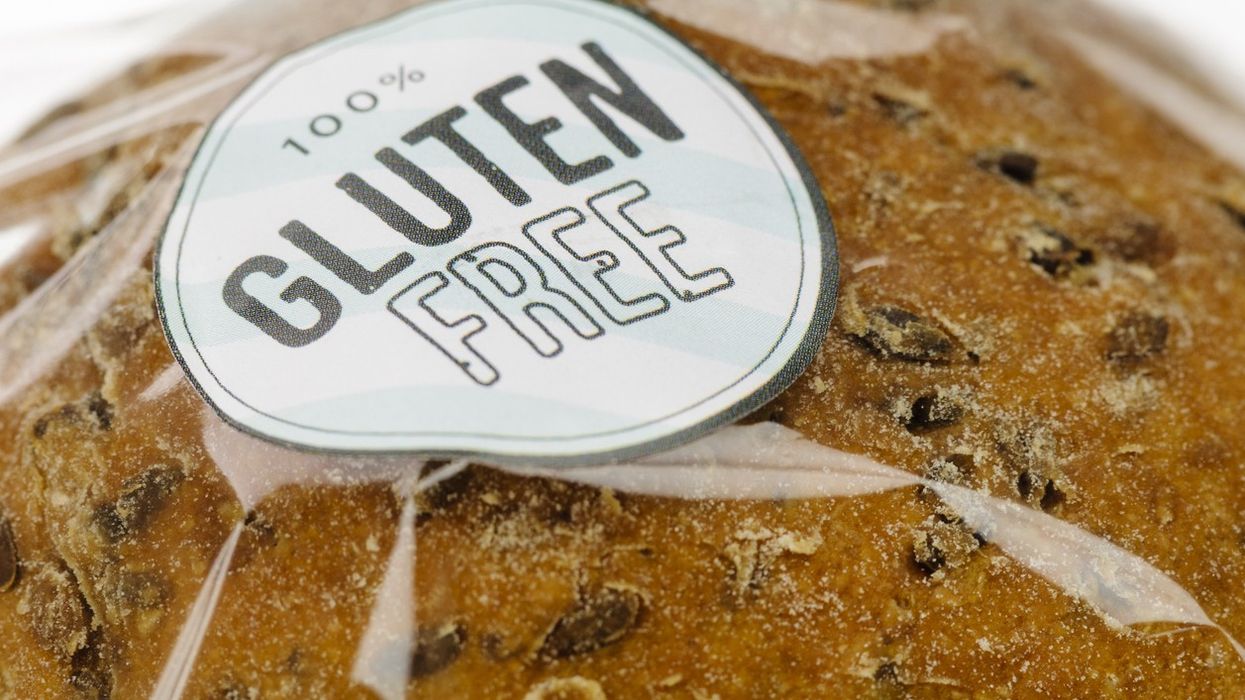 "100% Gluten Free" sticker on a loaf of brown seeded bread