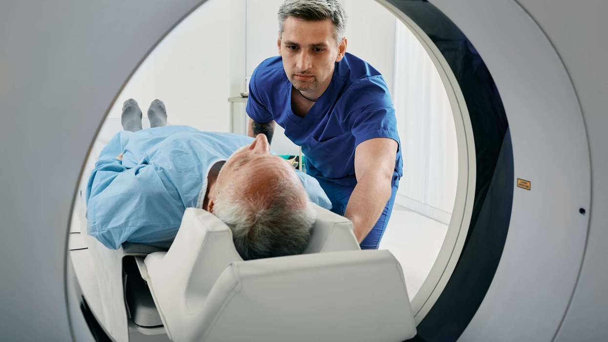 A senior patient undergoing CT scan