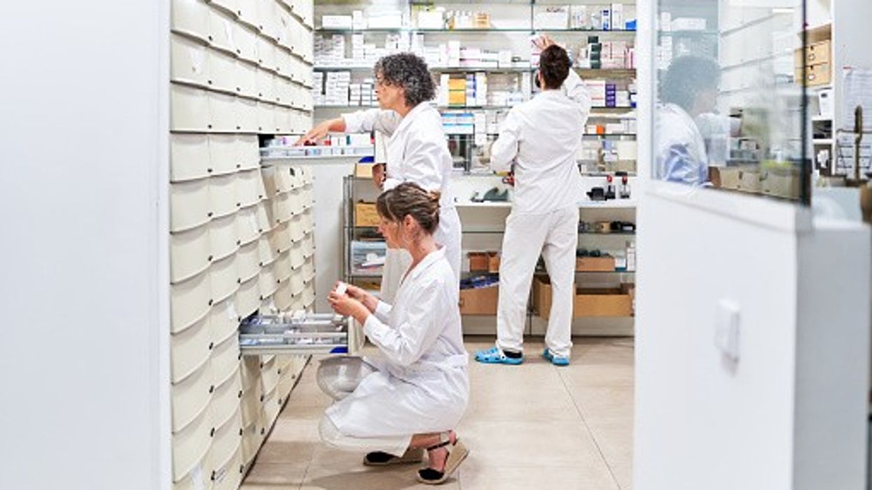 Pharmacists sorting medications in the pharmacy