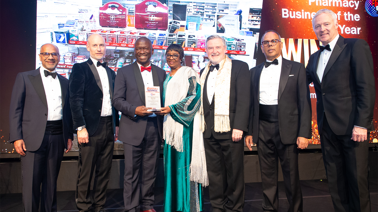 Pharmacy Business Awards trophy with a celebratory background, symbolizing achievement and recognition.