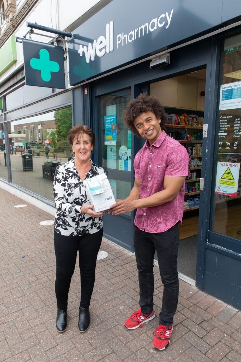 Radzi and Kathryn Outside Pharmacy