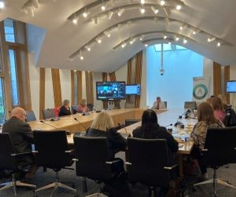 Round table meeting at Scottish Parliament in progress e1665032038889