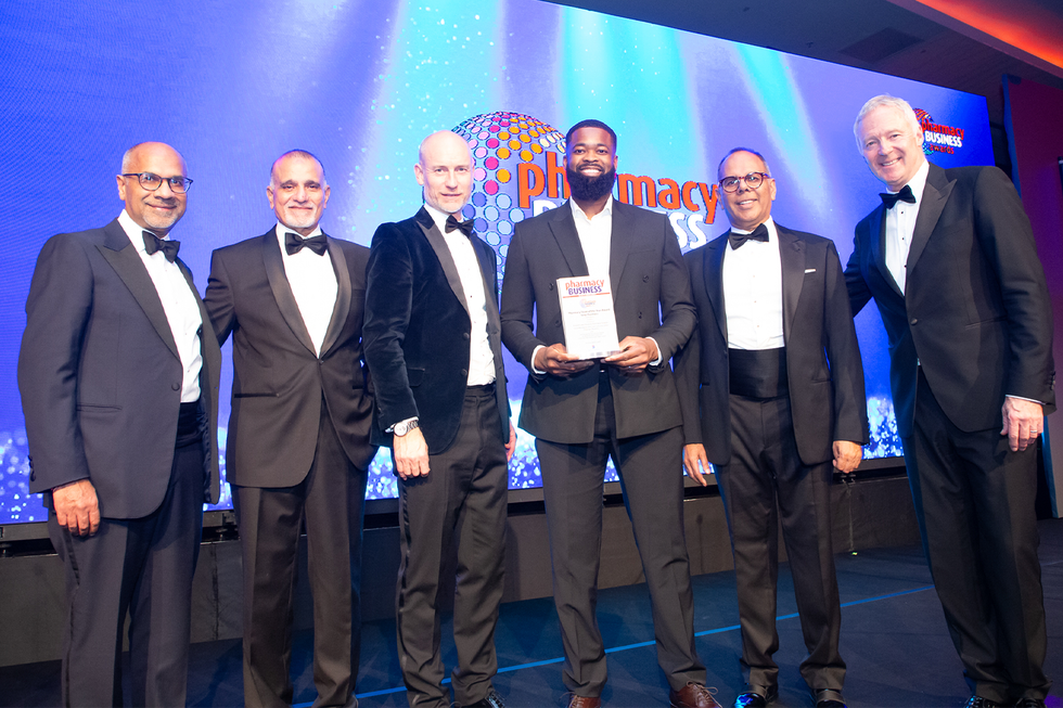 Samson Akere collecting his award at the Pharmacy Business Awards