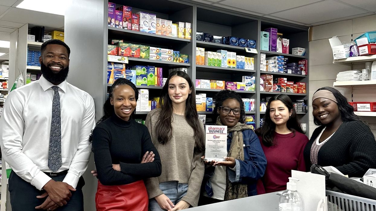 Samson Akere with the Totty Pharmacy team