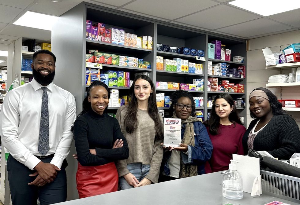 Samson Akere with the Totty Pharmacy team
